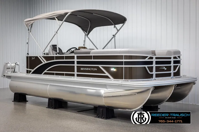 Slide: The Image of 2025 Bennington 21 SLSE pontoon boat with canopy in showroom. - 3