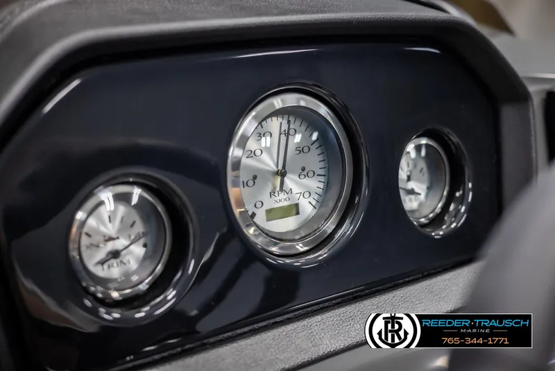 Slide: The Image of Dashboard gauges of 2025 Bennington 21 SLSE boat, featuring RPM and speed indicators. - 32