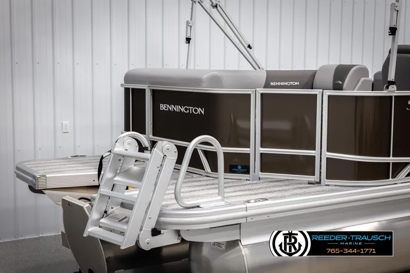 Slide: The Image of 2025 Bennington 21 SLSE pontoon boat with sleek design and sturdy ladder. - 43