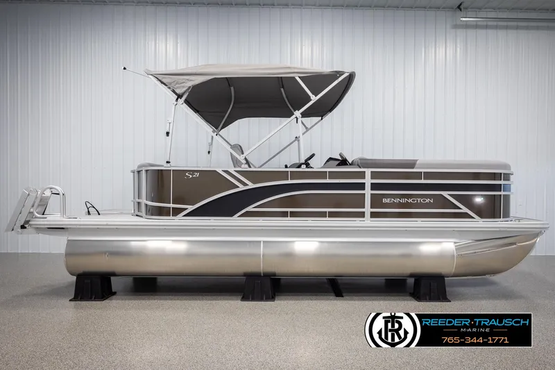 Slide: The Image of 2025 Bennington 21 SLSE pontoon boat with canopy in showroom. - 5