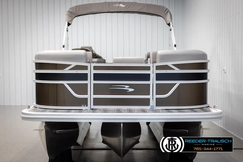 Slide: The Image of 2025 Bennington 21 SLSE pontoon boat in showroom, front view. - 8