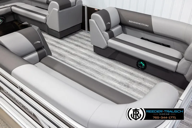Slide: The Image of 2025 Bennington 21 SLSE pontoon boat interior with gray seating and striped flooring. - 9