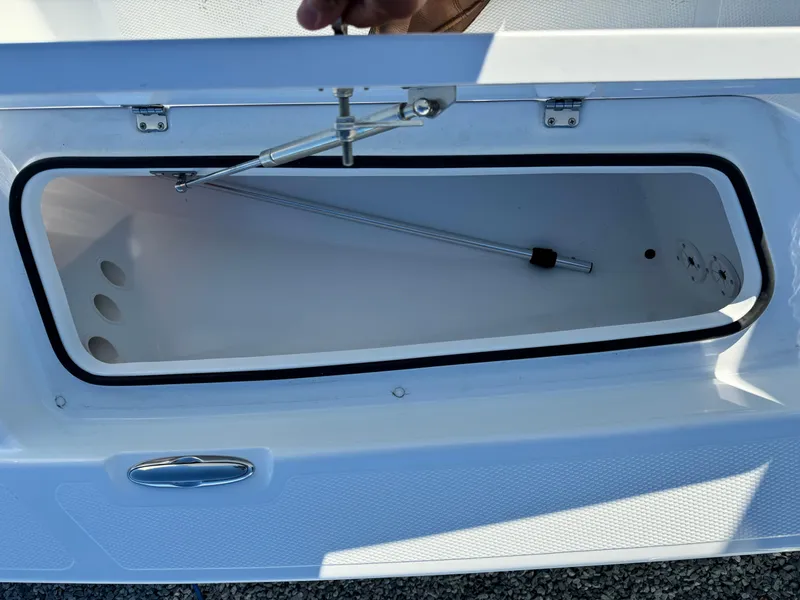 Slide: The Image of 2025 Frontier 2104 boat with Yamaha engine on trailer in parking lot. - 11