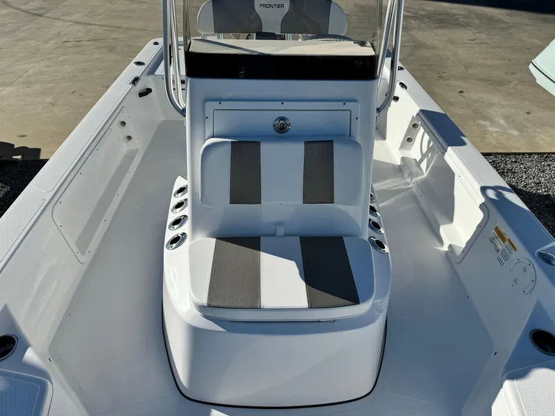 Slide: The Image of 2025 Frontier 2104 boat with Yamaha engine on trailer in sunny marina. - 14