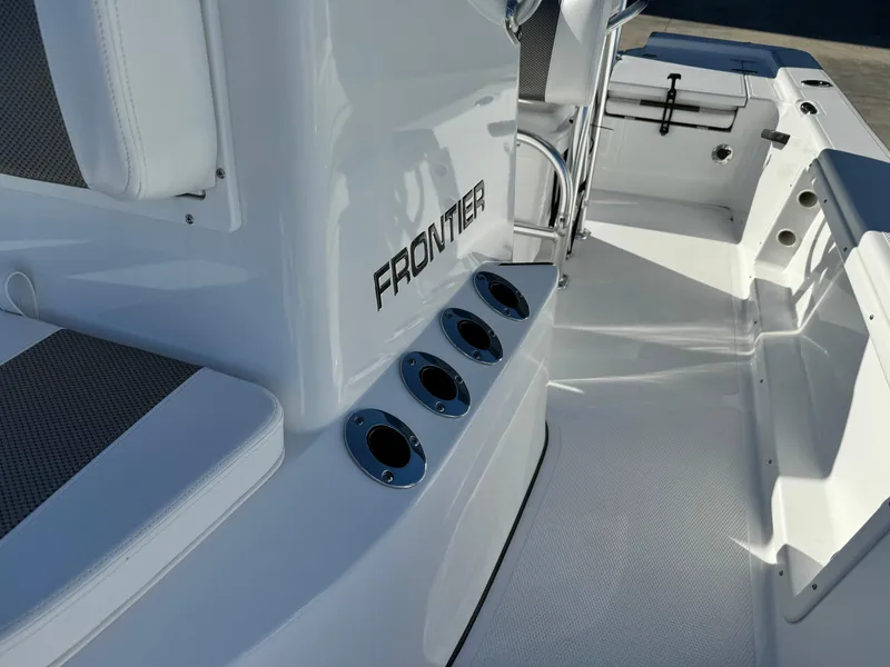 Slide: The Image of 2025 Frontier 2104 boat interior with seating and storage compartments. - 17