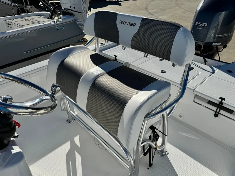 Slide: The Image of 2025 Frontier 2104 boat deck with storage compartments, viewed from above. - 18