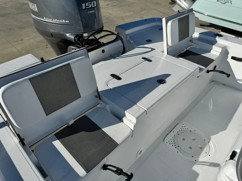 Slide: The Image of 2025 Frontier 2104 boat with sleek white design and modern seating. - 22