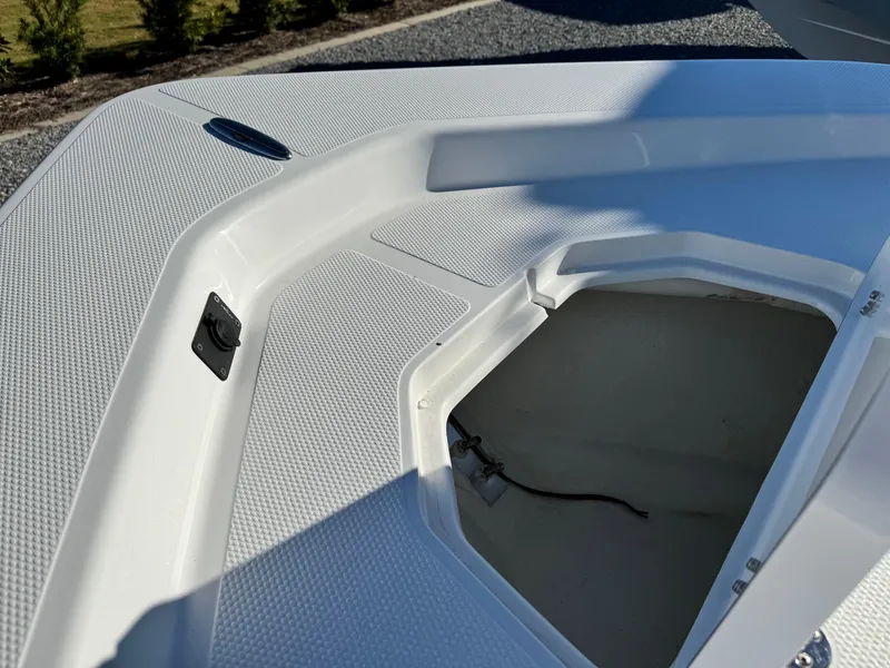 Slide: The Image of 2025 Frontier 2104 boat on trailer with Yamaha engine, parked outdoors under clear blue sky. - 9