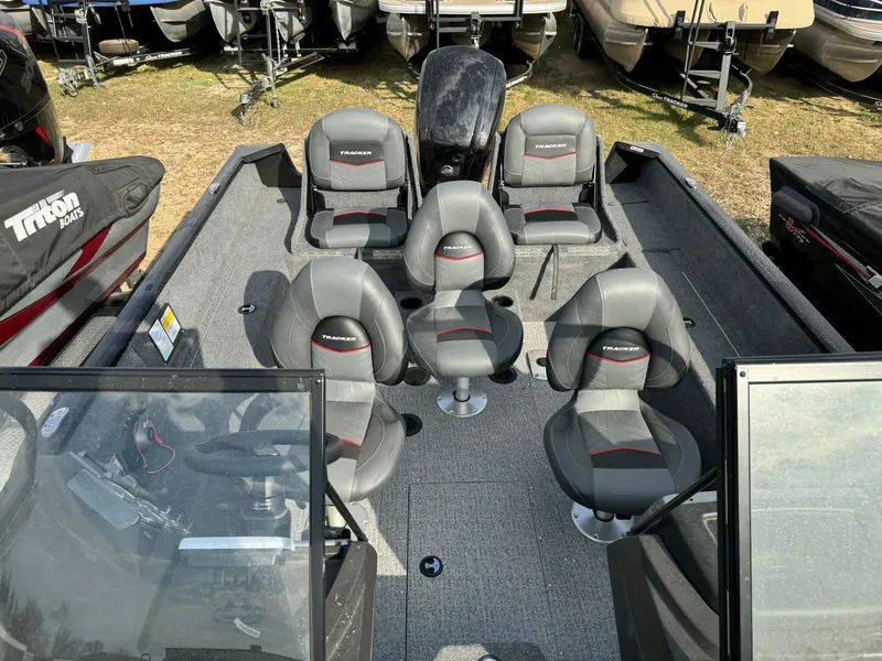 Slide: The Image of 2022 Tracker Pro Guide V-175 WT boat interior with five seats and steering console. - 14