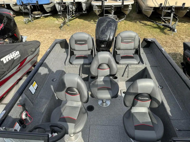 Slide: The Image of 2022 Tracker Pro Guide V-175 WT boat interior with five gray seats. - 15