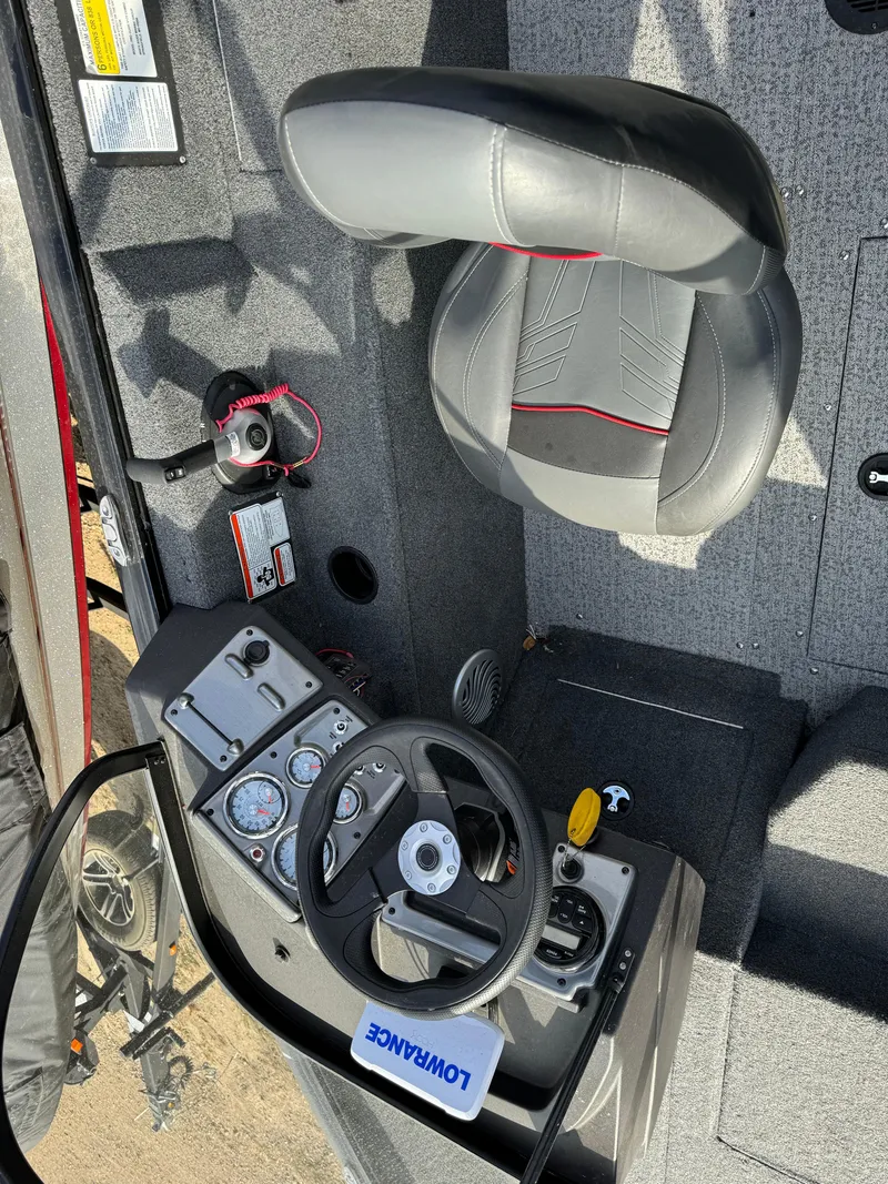 Slide: The Image of 2022 Tracker Pro Guide V-175 WT boat interior with steering wheel and seat. - 6