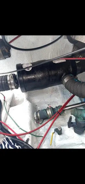 Slide: The Image of Engine compartment of 1989 Luhrs 320 Tournament boat with visible hoses and wiring. - 9