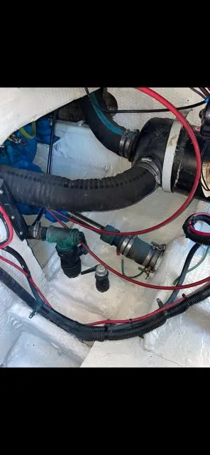 Slide: The Image of Engine compartment of 1989 Luhrs 320 Tournament boat with hoses and wiring. - 8