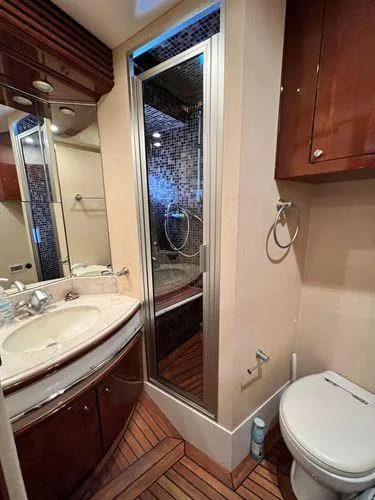Slide: The Image of Luxurious bathroom in 2005 Marquis 65 yacht with shower, sink, and toilet. - 21