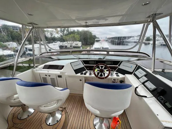 Slide: The Image of Luxury yacht helm of 2005 Marquis 65 with dual seats and navigation equipment. - 24