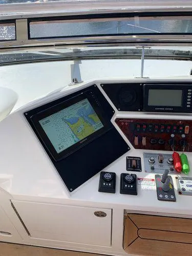 Slide: The Image of Control panel of 2005 Marquis 65 yacht with navigation display and controls. - 25