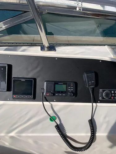 Slide: The Image of Control panel of a 2005 Marquis 65 yacht with navigation equipment. - 26