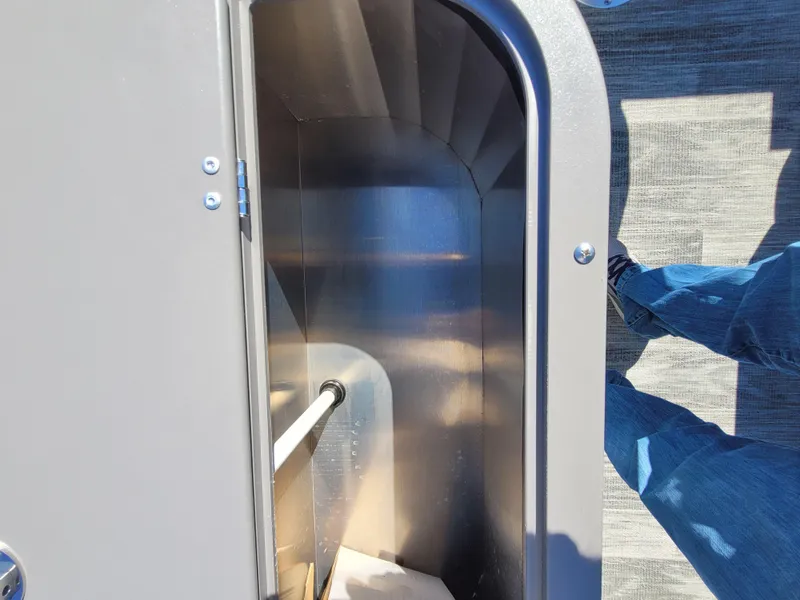 Slide: The Image of Quest M-8524 Angler Series 2025 boat storage compartment with metallic interior. - 14