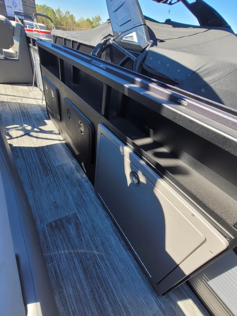 Slide: The Image of 2025 Quest M-8524 Angler Series boat interior with storage compartments. - 17