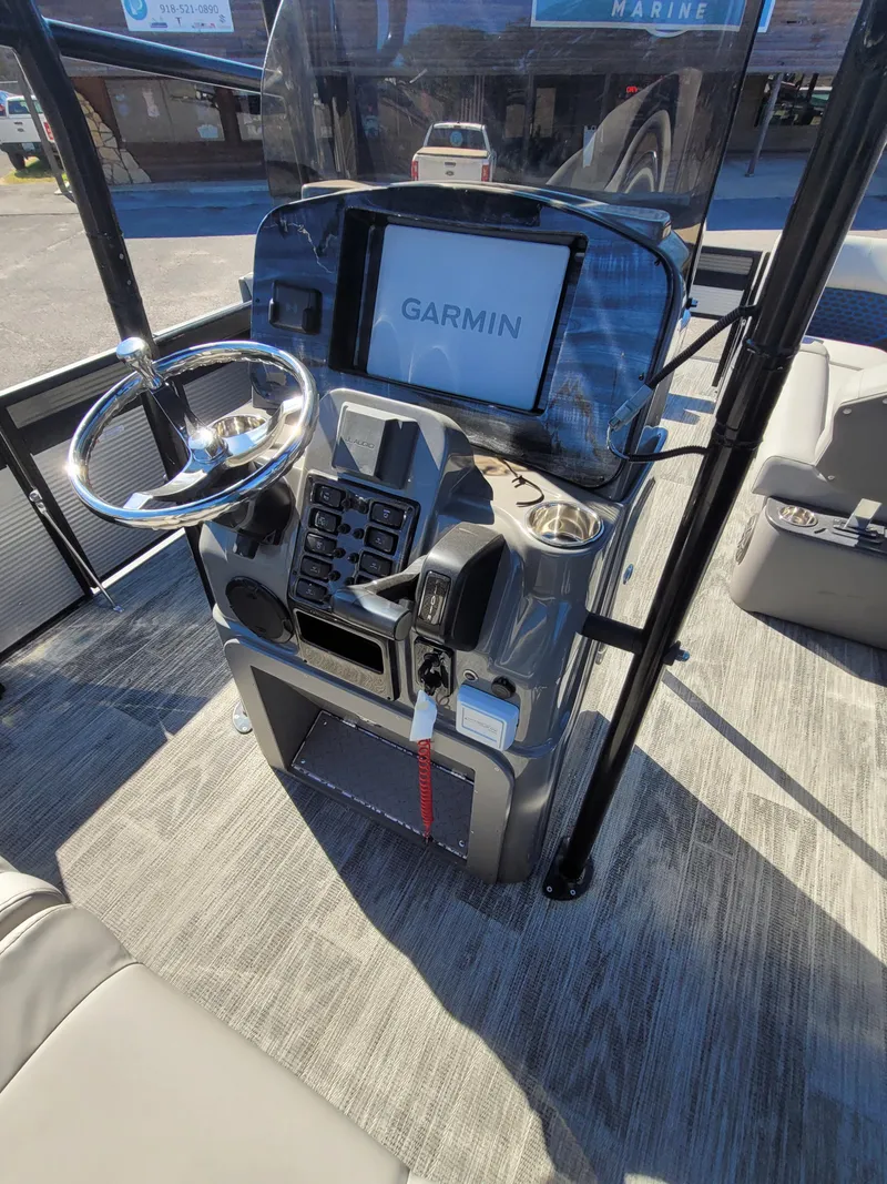 Slide: The Image of 2025 Quest M-8524 Angler Series boat console with Garmin navigation system. - 24