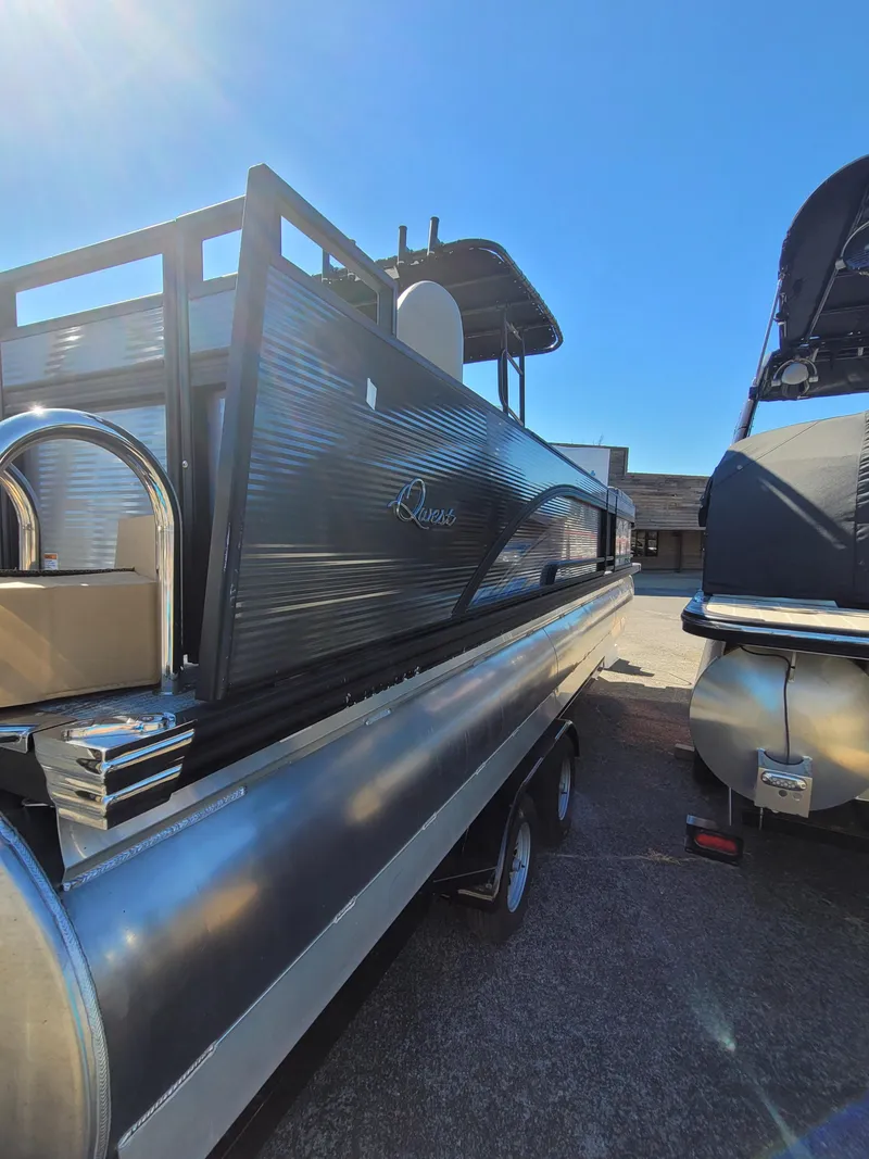 Slide: The Image of 2025 Quest M-8524 Angler Series pontoon boat in a sunny marina. - 3