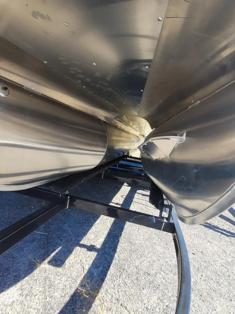 Slide: The Image of Close-up of 2025 Quest M-8524 Angler Series boat hull on trailer. - 5