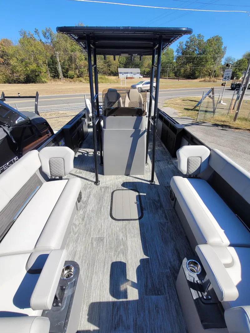 Slide: The Image of 2025 Quest M-8524 Angler Series boat interior with seating and canopy. - 6