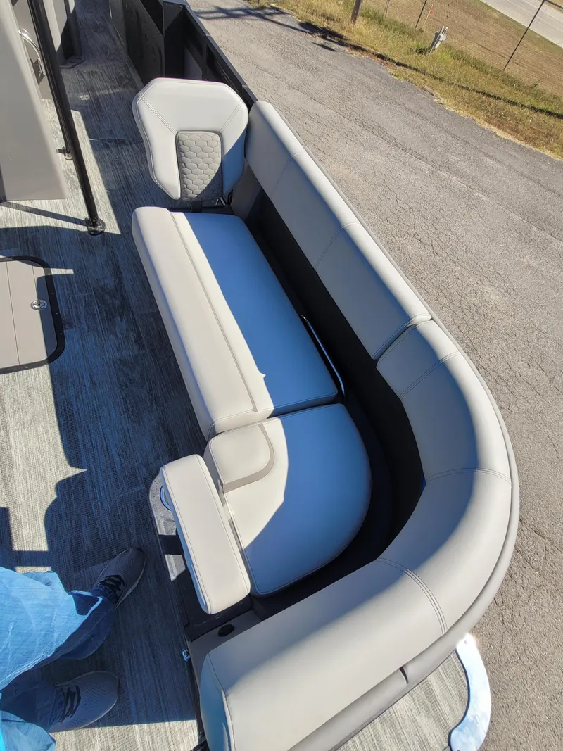 Slide: The Image of 2025 Quest M-8524 Angler Series boat interior with gray seating and modern design. - 7