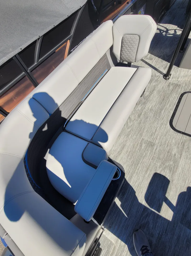 Slide: The Image of 2025 Quest M-8524 Angler Series boat interior with gray seating and modern design. - 8