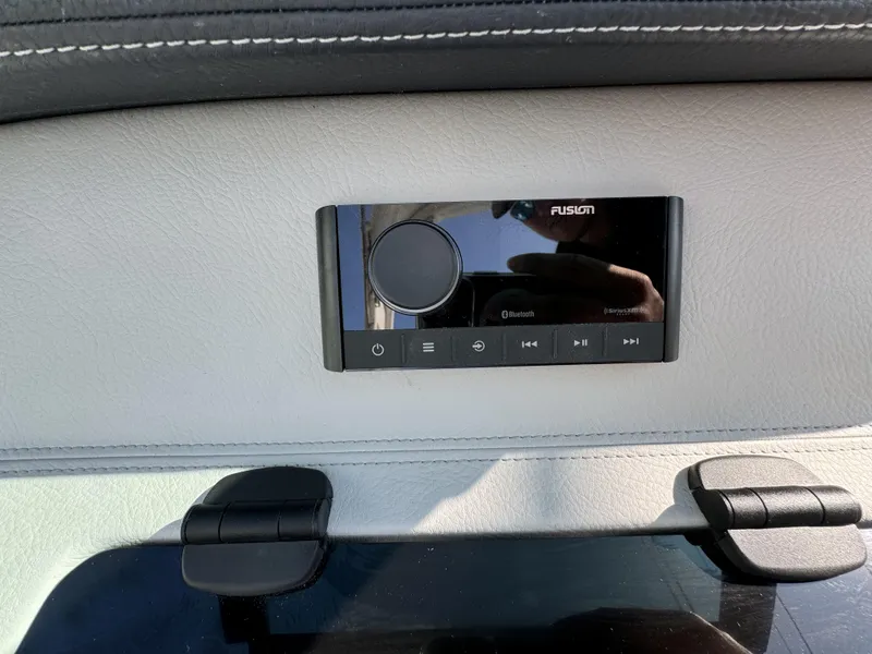 Slide: The Image of 2025 Regal LS2 boat audio control panel with Bluetooth and SiriusXM features. - 12