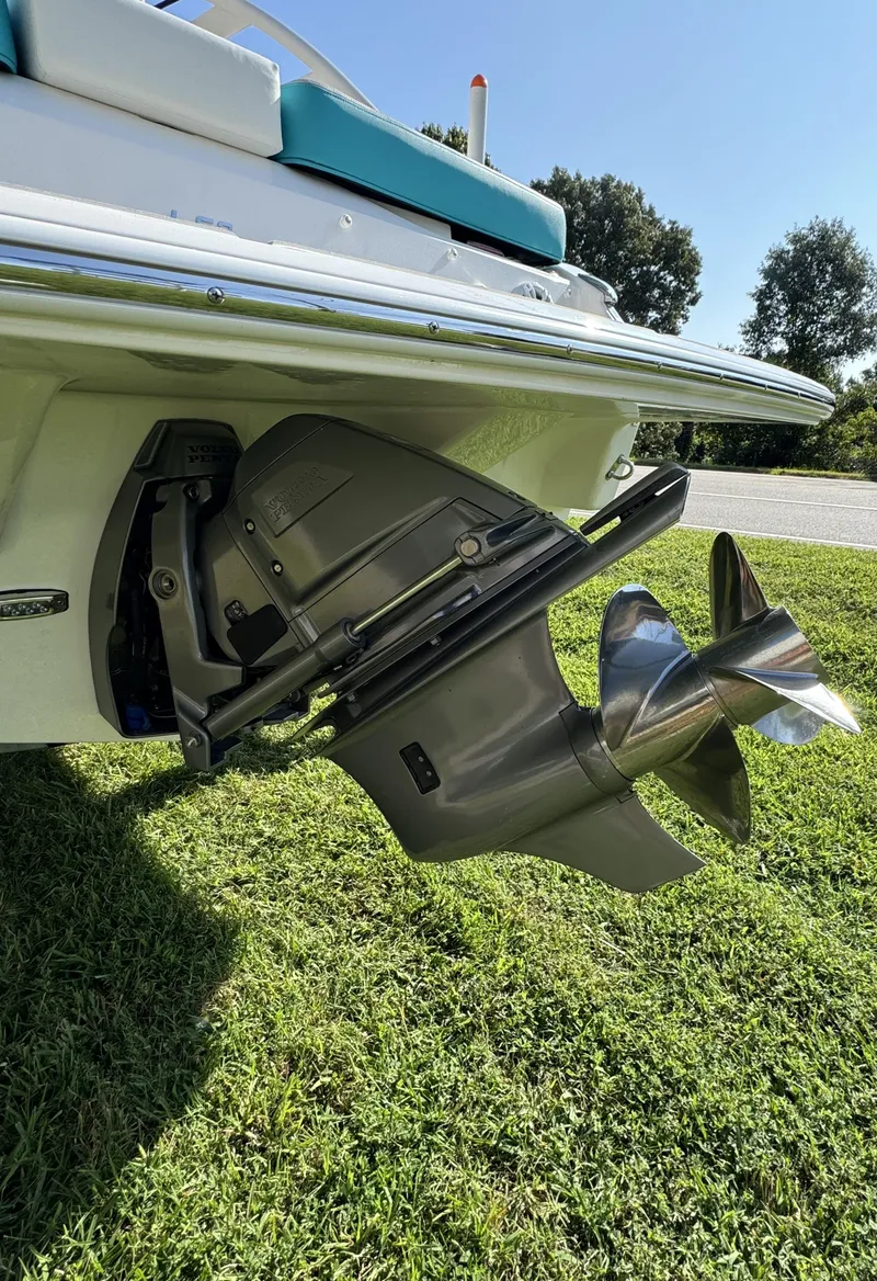 Slide: The Image of 2025 Regal LS2 boat with stainless steel propeller on grass. - 8