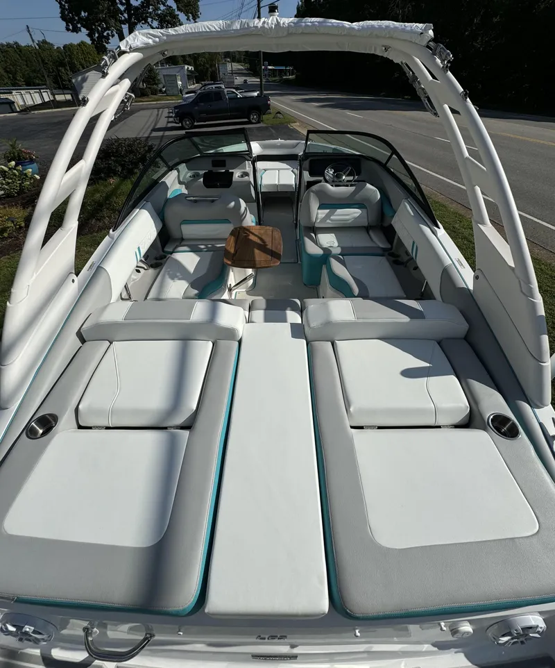 Slide: The Image of 2025 Regal LS2 boat interior with white seating and sleek design. - 9