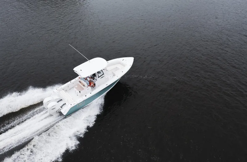 Slide: The Image of 2025 Sea Hunt Ultra 275 SE boat cruising on open water. - 10