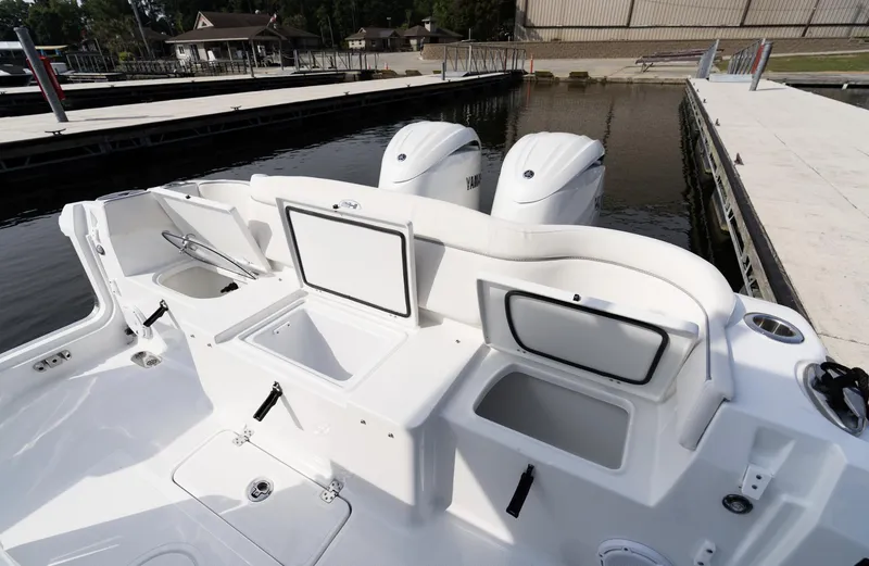 Slide: The Image of 2025 Sea Hunt Ultra 275 SE boat with dual engines at dock. - 15
