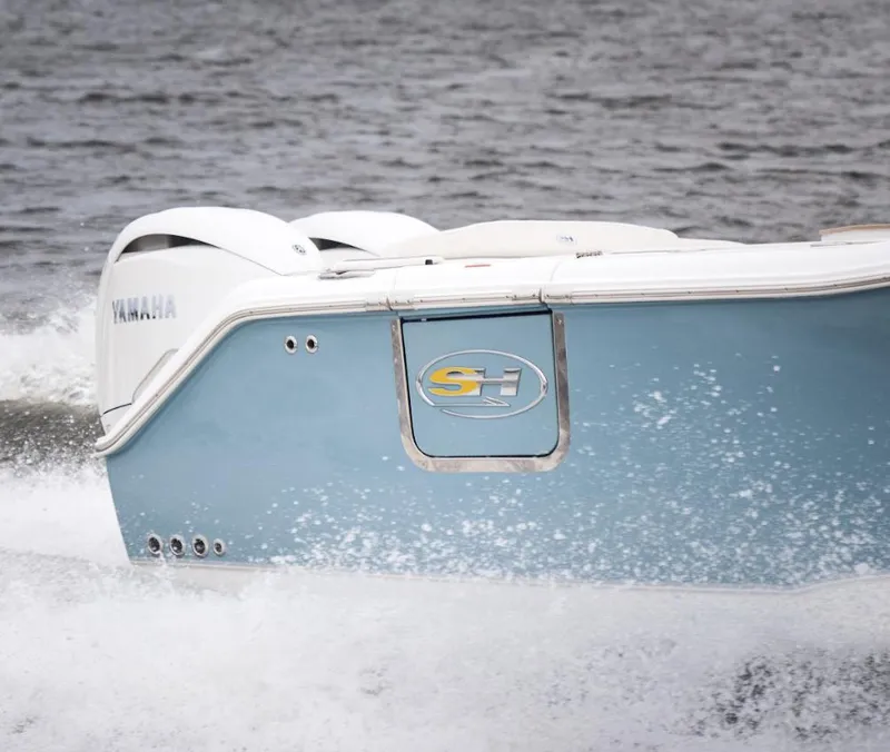 Slide: The Image of 2025 Sea Hunt Ultra 275 SE boat cruising on water with Yamaha engines. - 21
