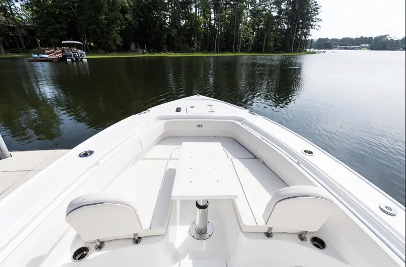 Slide: The Image of 2025 Sea Hunt Ultra 275 SE boat on a serene lake. - 31