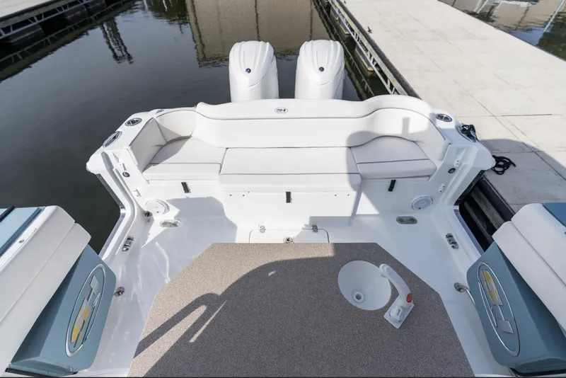 Slide: The Image of 2025 Sea Hunt Ultra 275 SE boat interior with dual engines at dock. - 34
