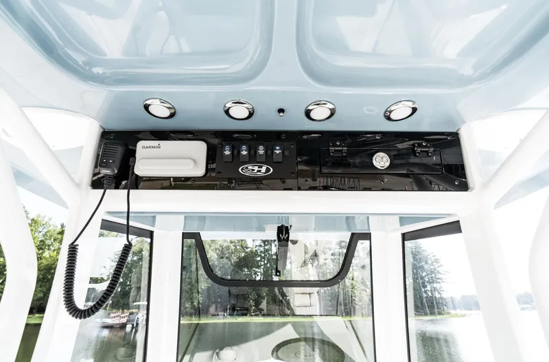 Slide: The Image of 2025 Sea Hunt Ultra 275 SE boat console with modern controls and lighting. - 5