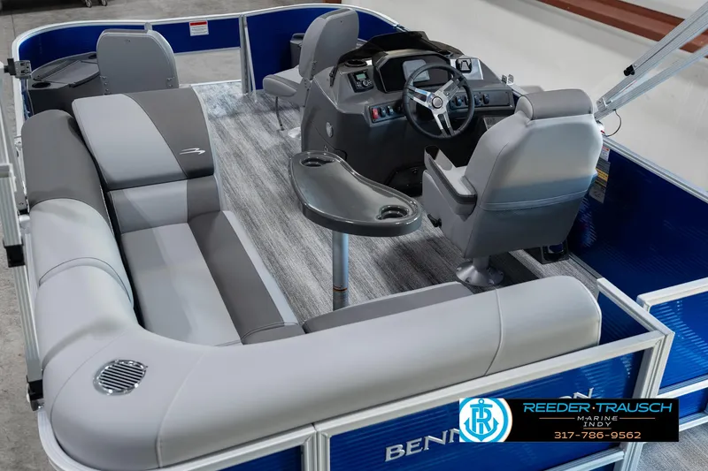 Slide: The Image of 2025 Bennington 168SF pontoon boat interior with gray seating and steering console. - 12