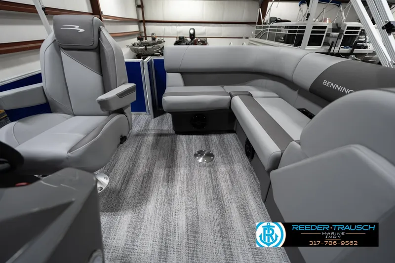 Slide: The Image of 2025 Bennington 168SF boat interior with gray seating and carpeted flooring. - 14