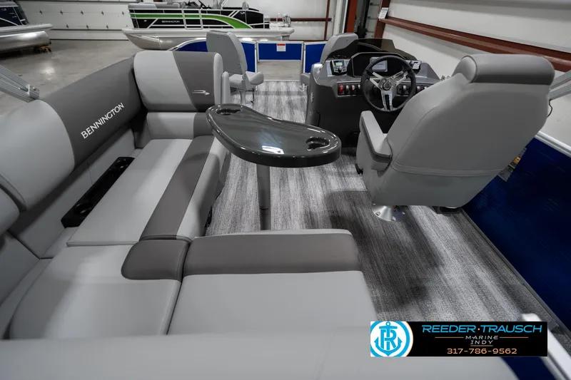 Slide: The Image of 2025 Bennington 168SF boat interior with gray seating and steering console. - 16