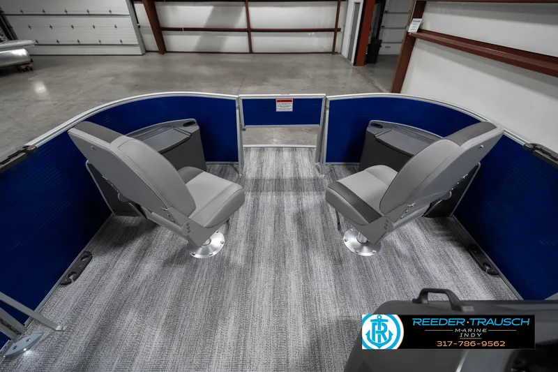 Slide: The Image of 2025 Bennington 168SF boat interior with two gray seats and blue paneling. - 18