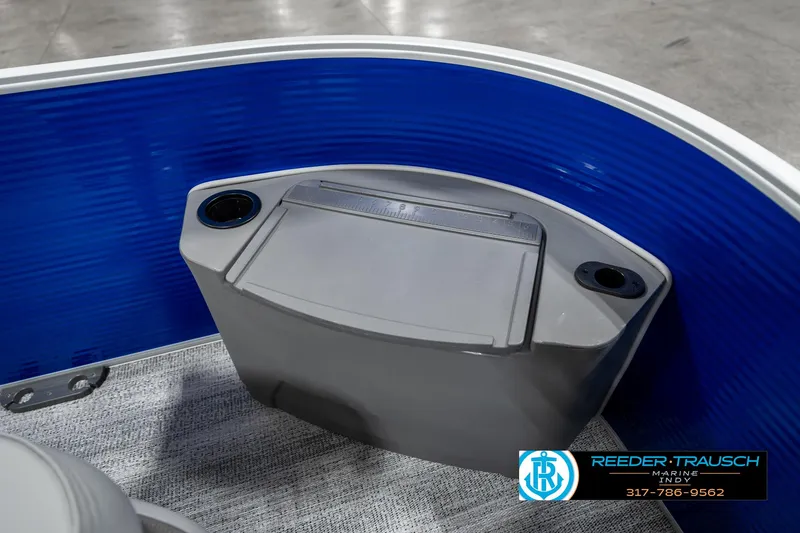 Slide: The Image of 2025 Bennington 168SF boat interior with blue paneling and storage compartment. - 20