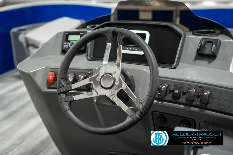 Slide: The Image of 2025 Bennington 168SF boat dashboard with steering wheel and controls. - 29