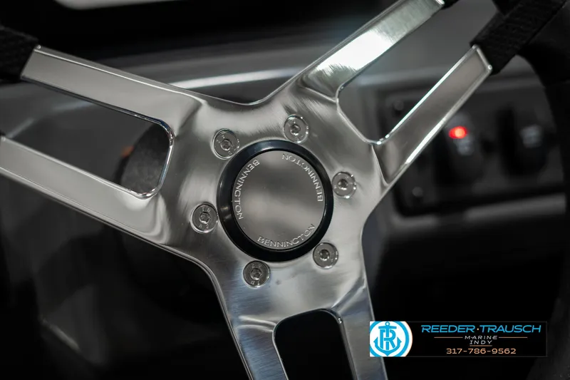Slide: The Image of Close-up of 2025 Bennington 168SF steering wheel with Reeder-Trausch logo. - 31