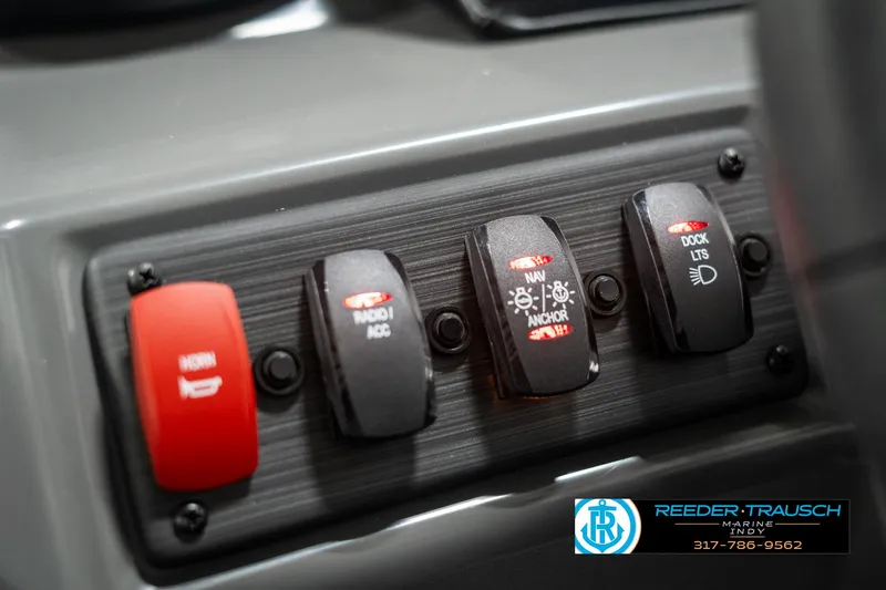 Slide: The Image of Control panel of 2025 Bennington 168SF boat with labeled switches. - 32