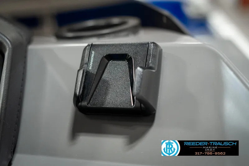 Slide: The Image of Close-up of a 2025 Bennington 168SF boat component with Reeder-Trausch branding. - 35