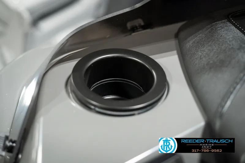 Slide: The Image of 2025 Bennington 168SF boat cup holder detail with Reeder-Trausch Marine logo. - 39