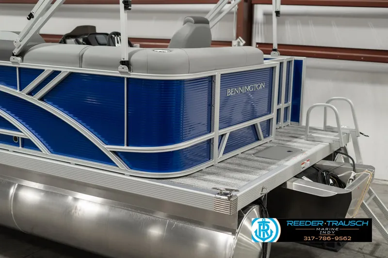Slide: The Image of 2025 Bennington 168SF pontoon boat with blue exterior and gray seating. - 43