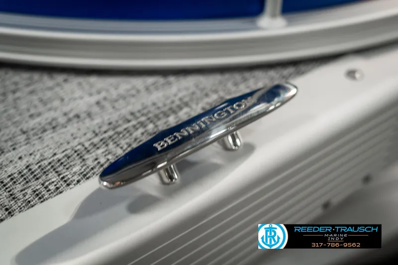 Slide: The Image of Close-up of 2025 Bennington 168SF boat cleat with Reeder-Trausch Marine logo. - 47